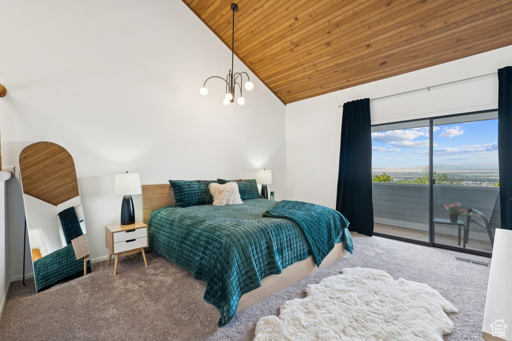 Bedroom with wooden ceiling, access to outside, high vaulted ceiling, carpet floors, and a chandelier