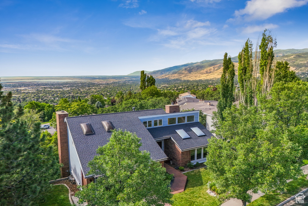 View of subject property with mountains