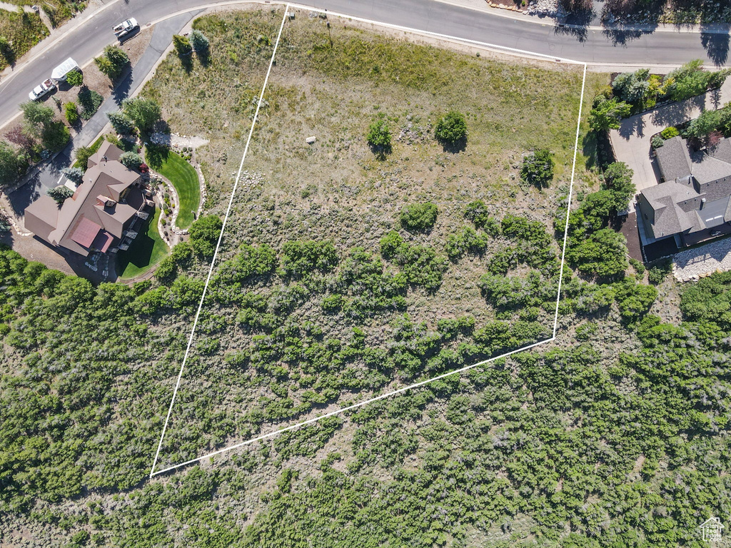 Aerial view of property and surrounding area with property boundaries highlighted