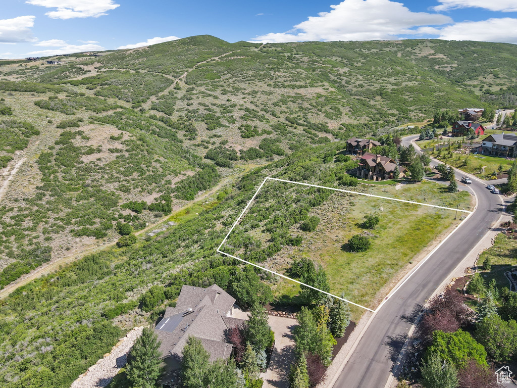 Aerial view of property\\\'s location with property parcel outlined and a mountain backdrop
