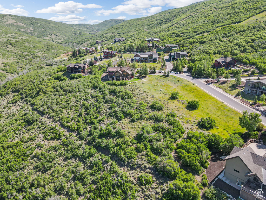 Aerial view of residential area featuring a mountain backdrop