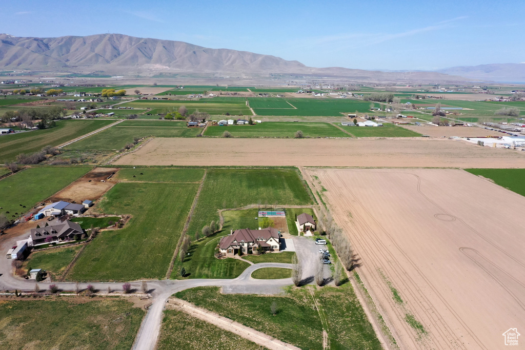 Aerial view of property's location with rural landscape and a mountain backdrop