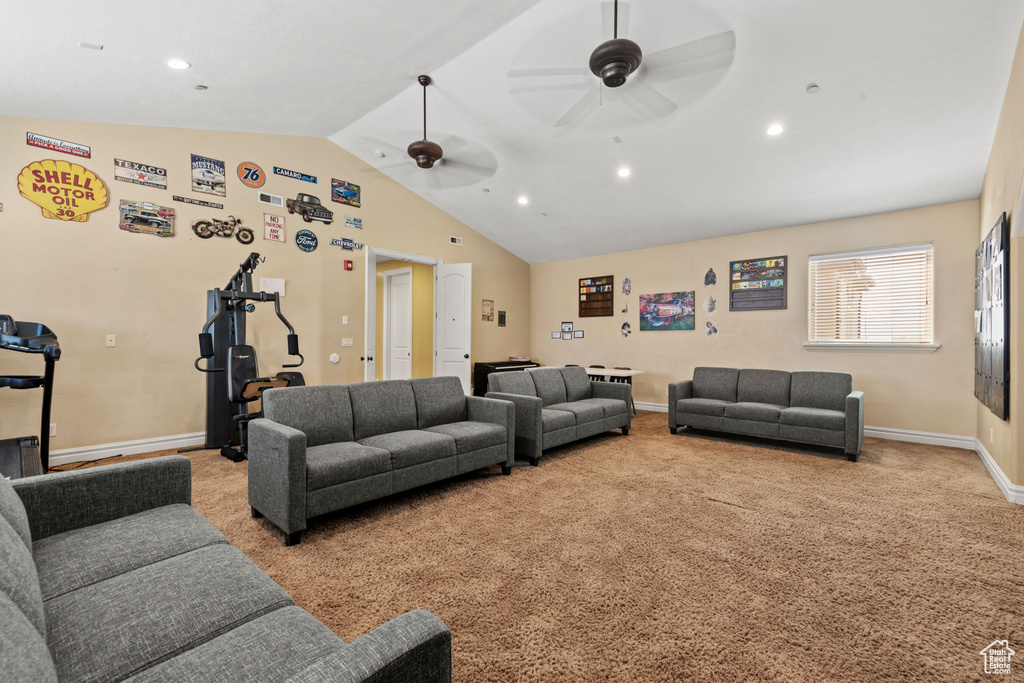 Carpeted living room with vaulted ceiling, ceiling fan, and recessed lighting