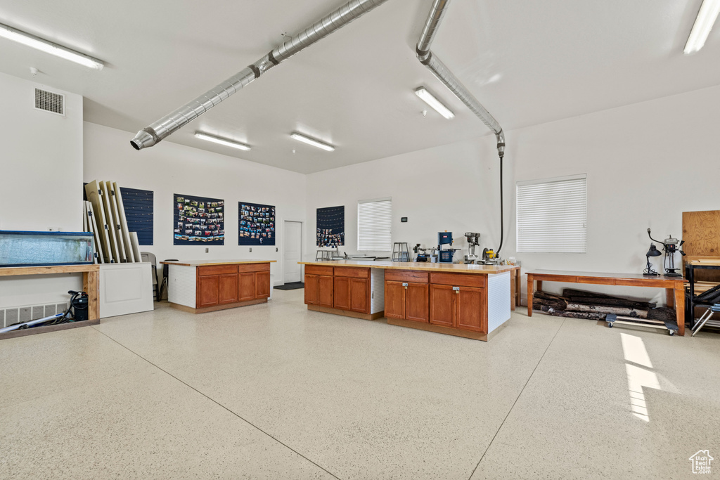 Misc room with dark speckled floor