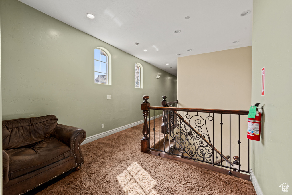 Hall featuring an upstairs landing, carpet, and recessed lighting