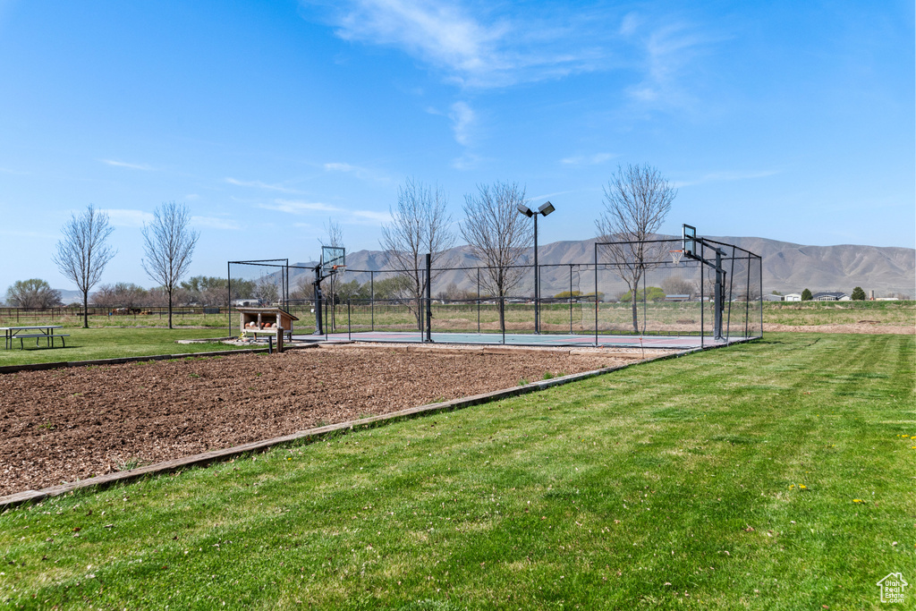 View of property\'s community with community basketball court and a mountain view