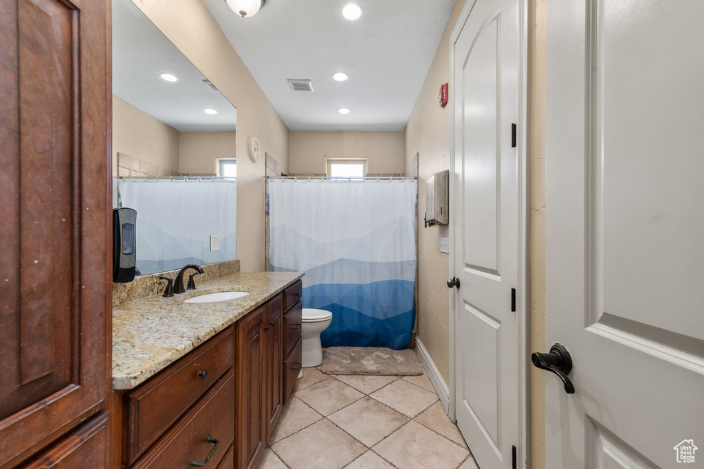 Bathroom featuring vanity, tile patterned flooring, recessed lighting, and a shower with shower curtain