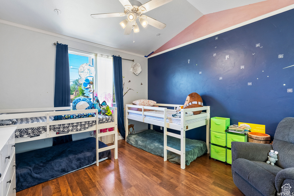 Bedroom featuring vaulted ceiling and wood finished floors