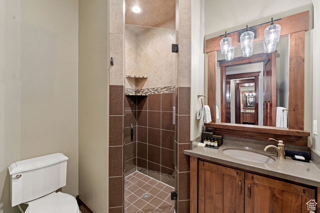 Bathroom featuring a stall shower and vanity