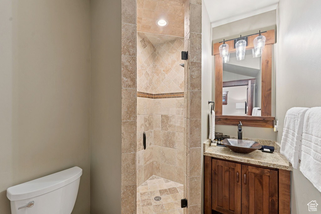 Bathroom featuring vanity and a shower stall