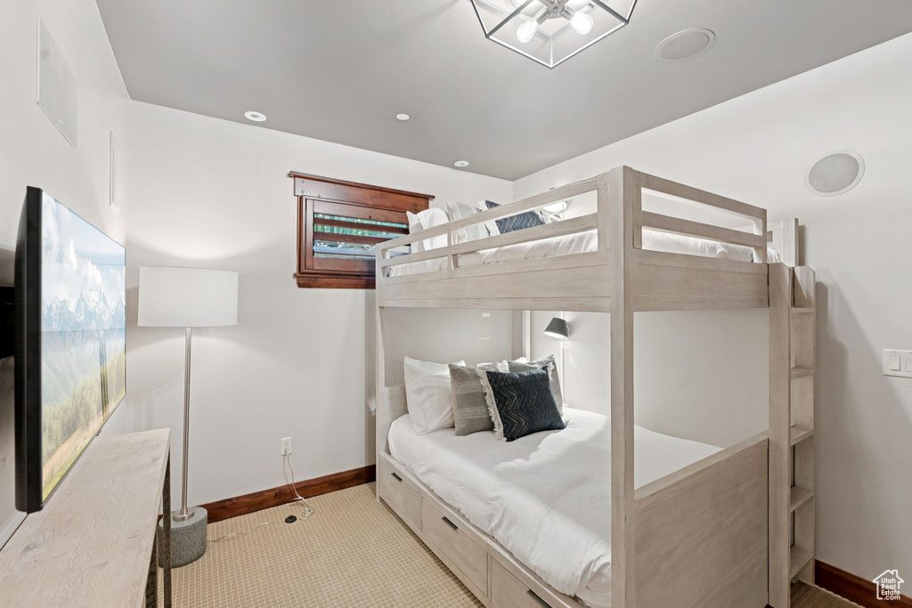 Carpeted bedroom featuring baseboards