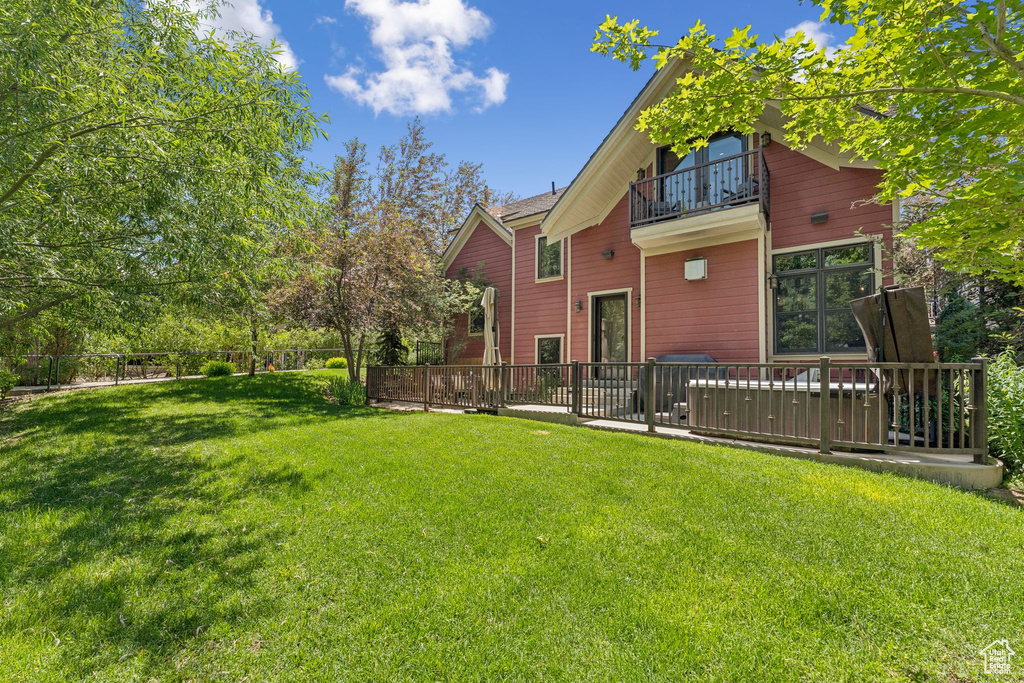 Rear view of property featuring a balcony