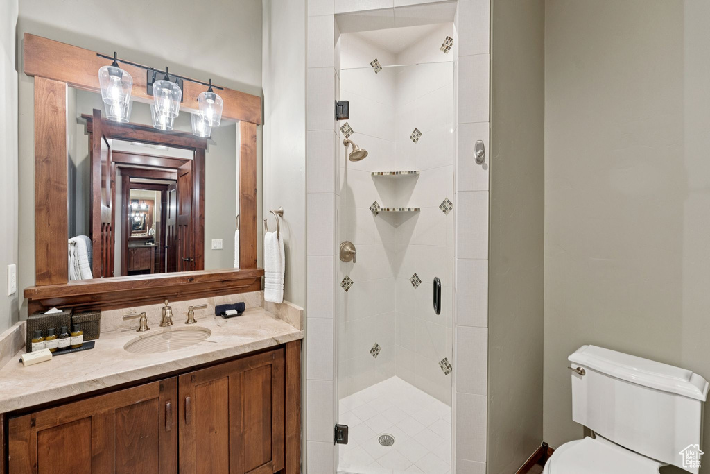Bathroom with a shower stall and vanity