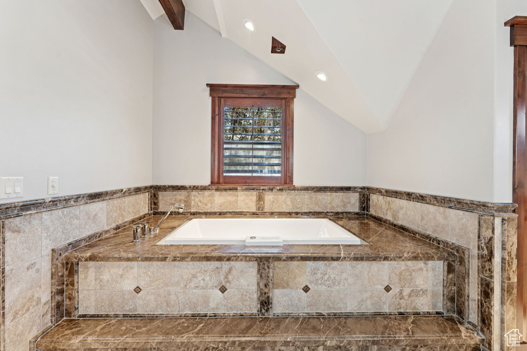 Bathroom with a bath and recessed lighting