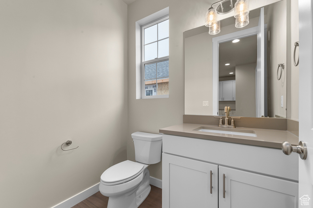 Bathroom with vanity and wood finished floors
