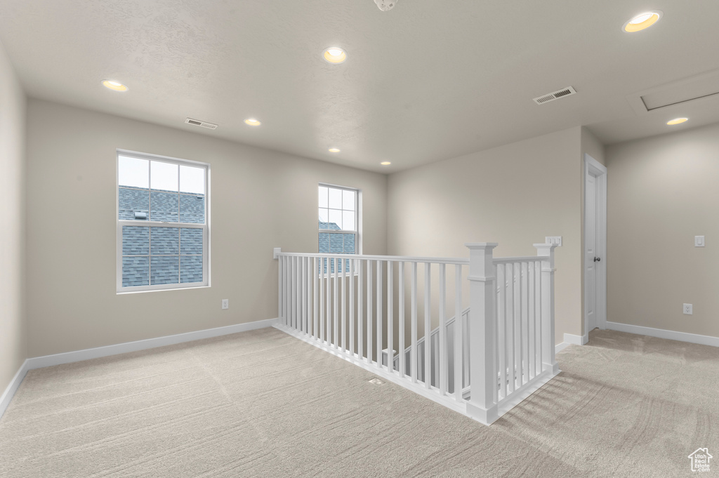 Spare room with carpet flooring and recessed lighting