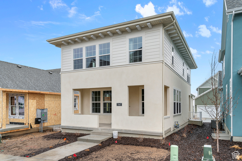 View of front of property with stucco siding