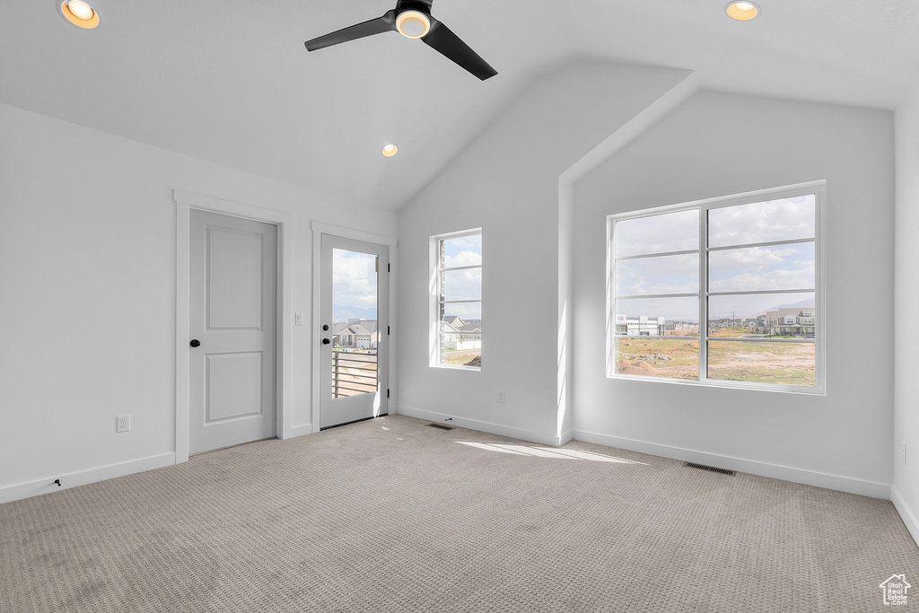 Unfurnished bedroom with vaulted ceiling, recessed lighting, light carpet, and a ceiling fan