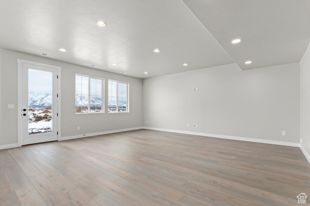 Unfurnished room featuring recessed lighting and light wood finished floors