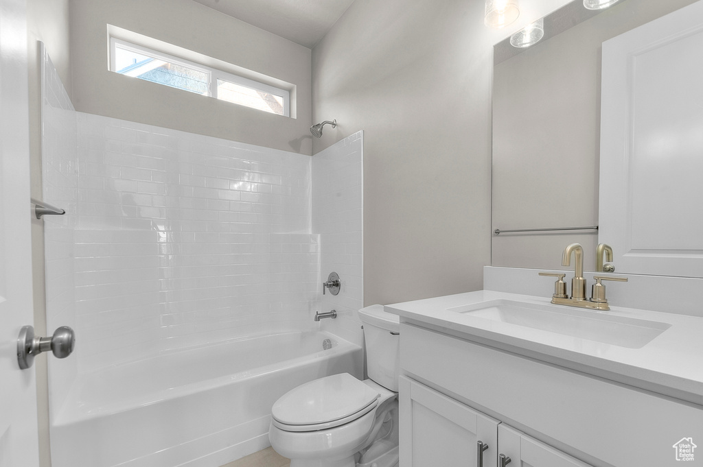 Full bath with vanity and shower / bath combination