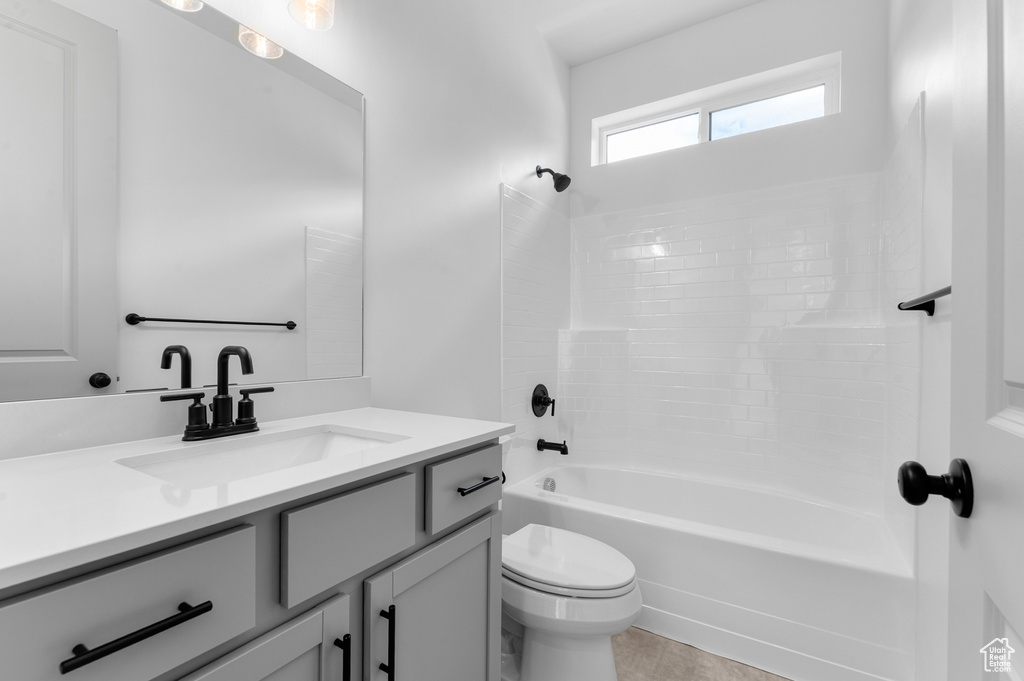 Bathroom with vanity and tub / shower combination