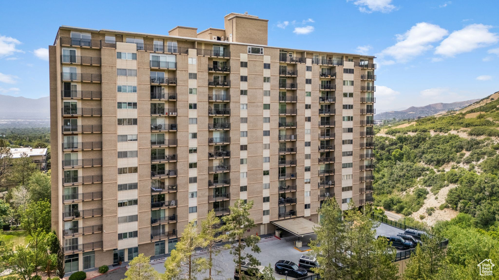 View of apartment building / complex featuring a mountain view