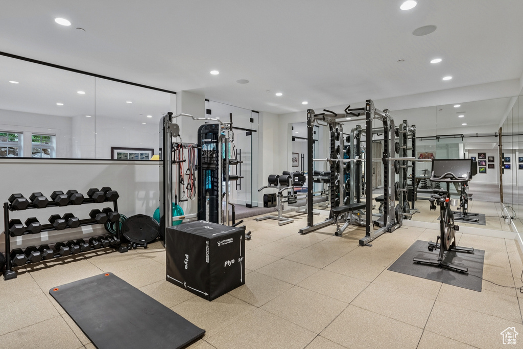 Workout area featuring recessed lighting
