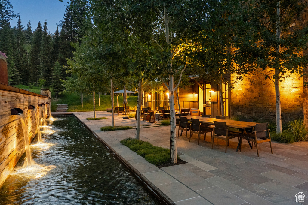 Surrounding community with a patio and outdoor dining space