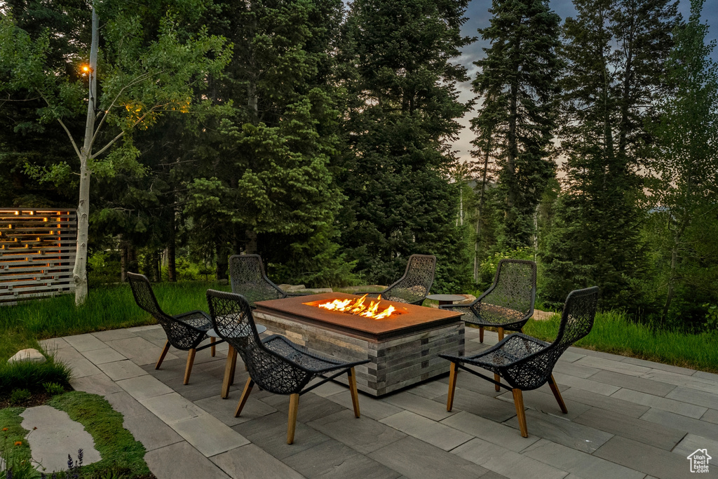 View of patio featuring an outdoor fire pit