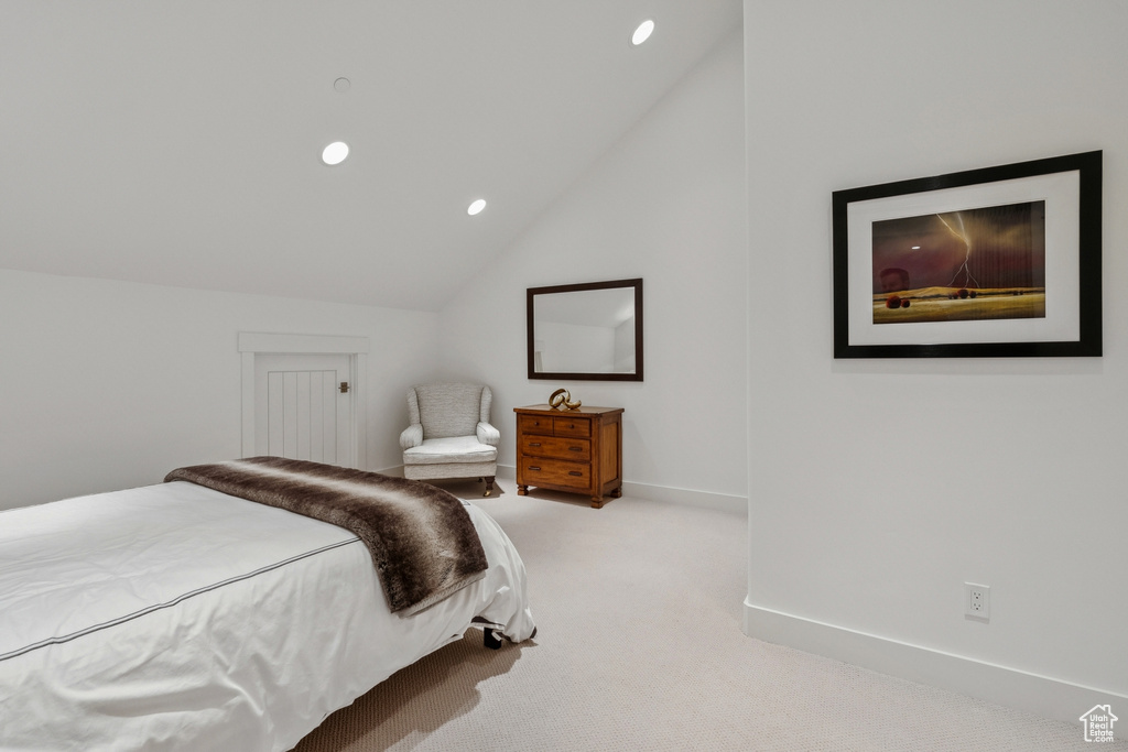 Bedroom with carpet, lofted ceiling, and recessed lighting