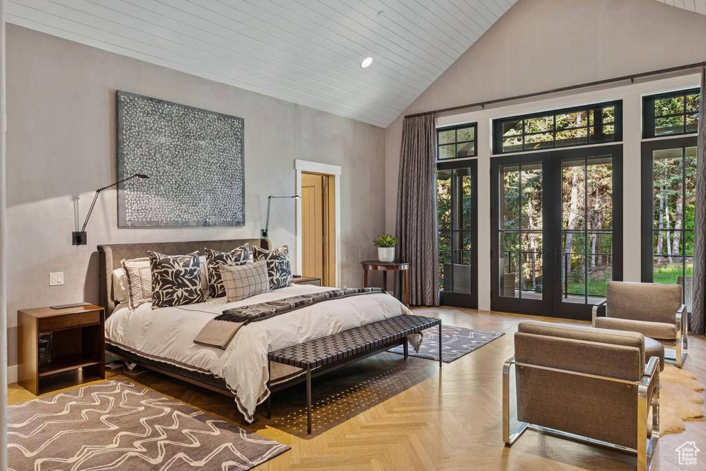 Bedroom with high vaulted ceiling and recessed lighting