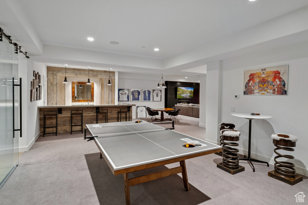 Game room with light colored carpet and recessed lighting