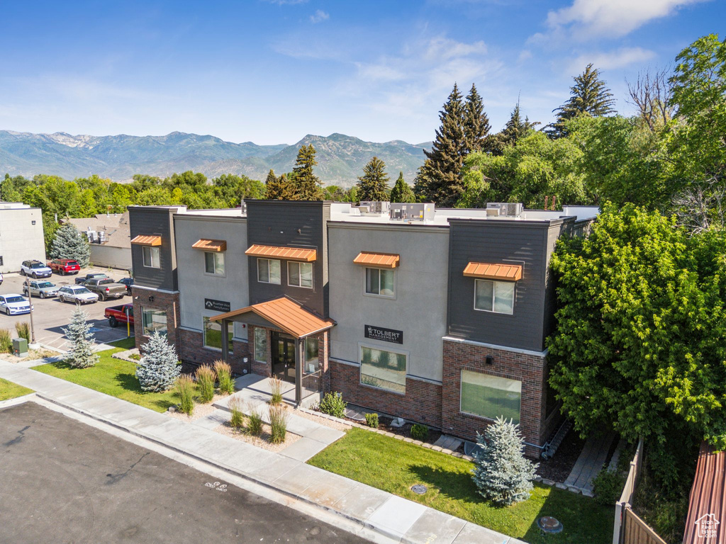 View of front facade with a mountain view and stucco siding