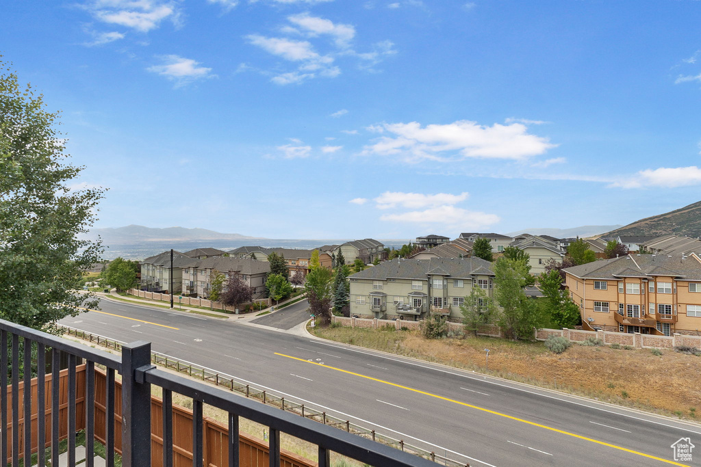 View of mountain backdrop featuring nearby suburban area