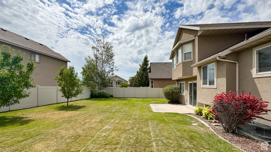 Fenced backyard featuring a patio area