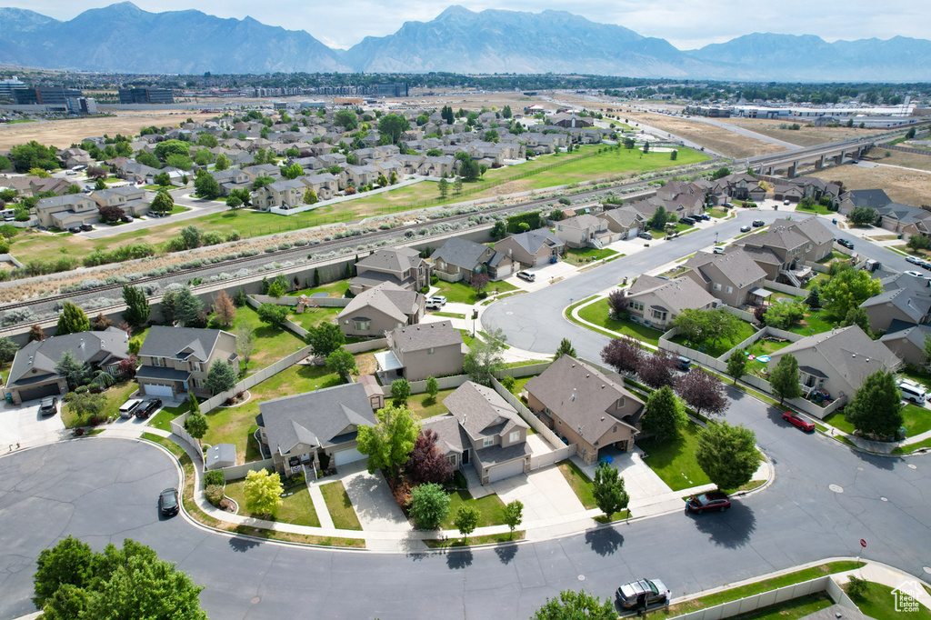 Aerial perspective of suburban area with a mountain backdrop