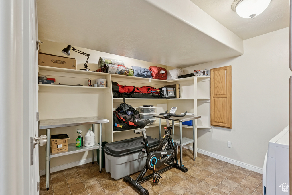 Storage area featuring washer / clothes dryer