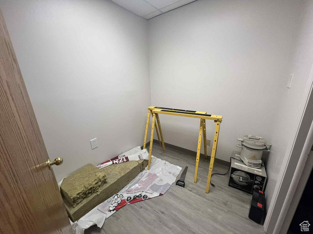 Bedroom with wood finished floors and baseboards