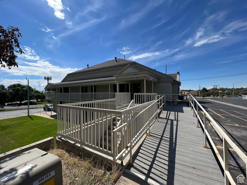 Back of property featuring a yard