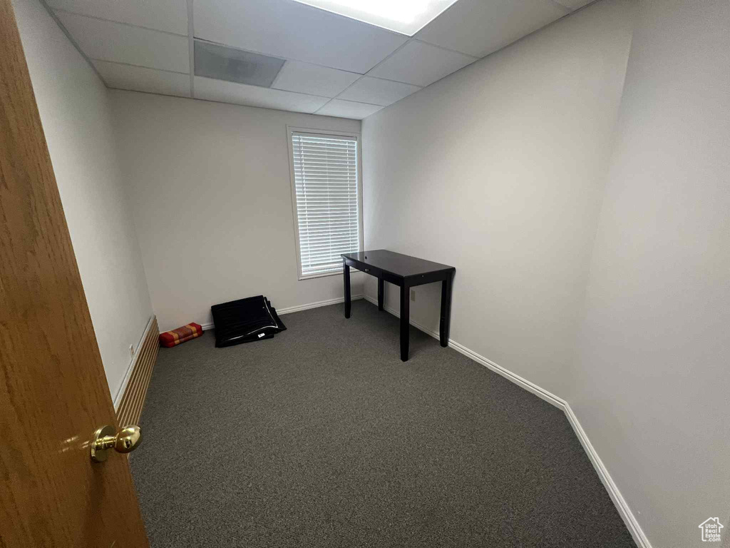 Miscellaneous room with carpet and a paneled ceiling
