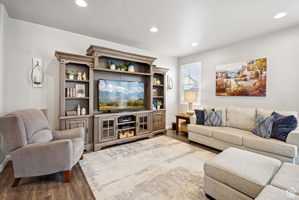 Living room featuring wood finished floors and recessed lighting