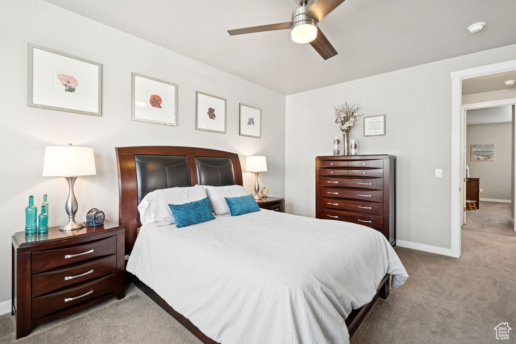 Bedroom featuring carpet flooring and a ceiling fan