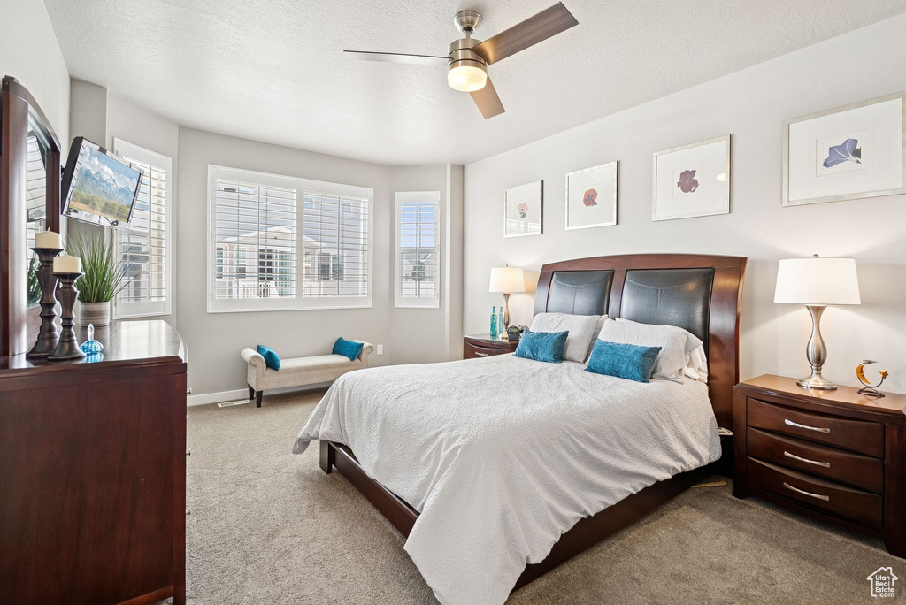 Bedroom with carpet and ceiling fan