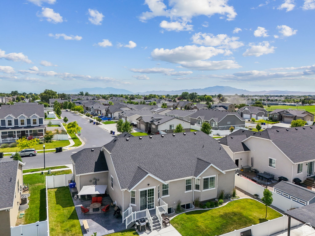 Aerial view of residential area with a mountainous background