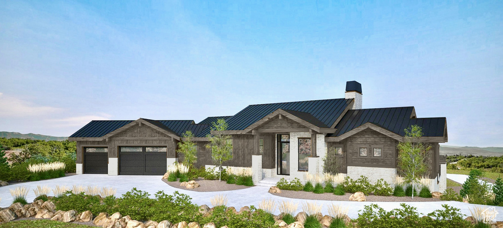 Contemporary home featuring a standing seam roof, an attached garage, a chimney, a metal roof, and driveway