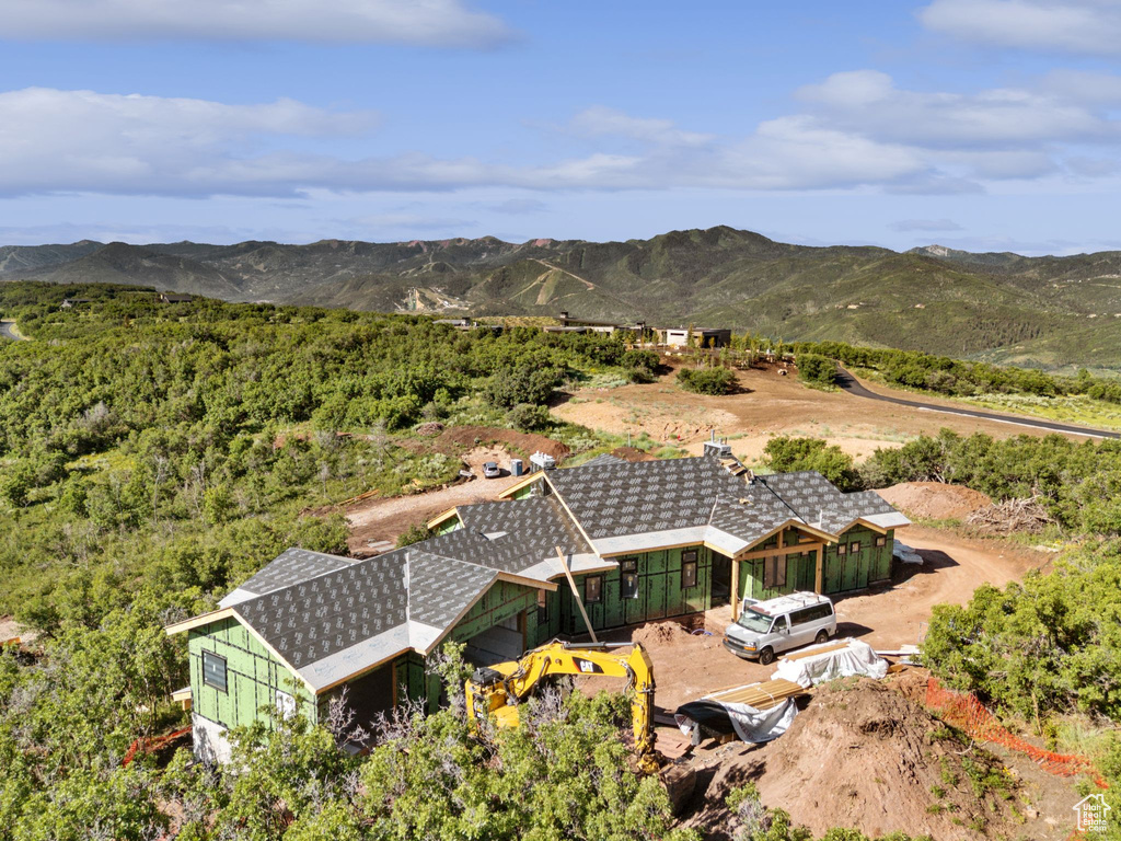 View of subject property with mountains