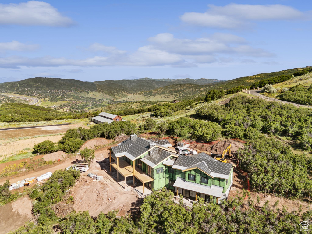 View from above of property with a mountain backdrop