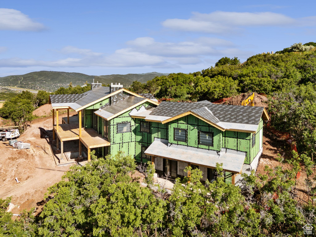 View of subject property featuring mountains