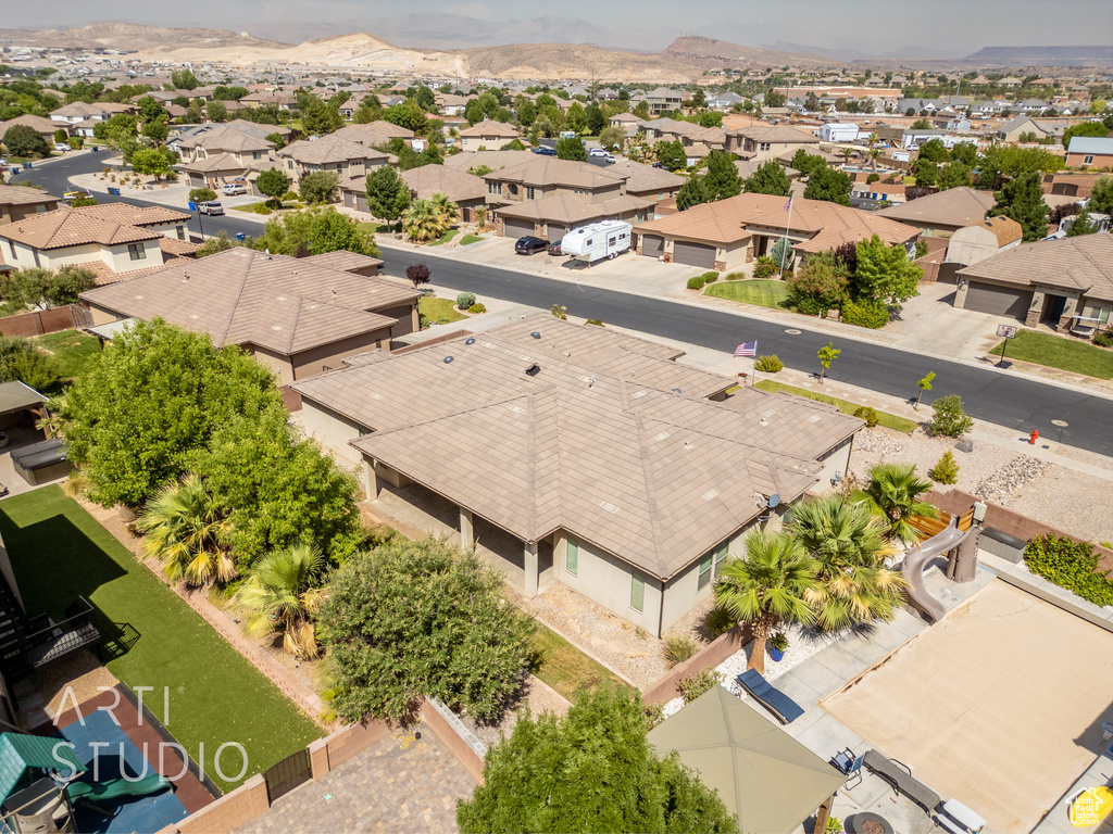 Aerial perspective of suburban area featuring a mountain backdrop