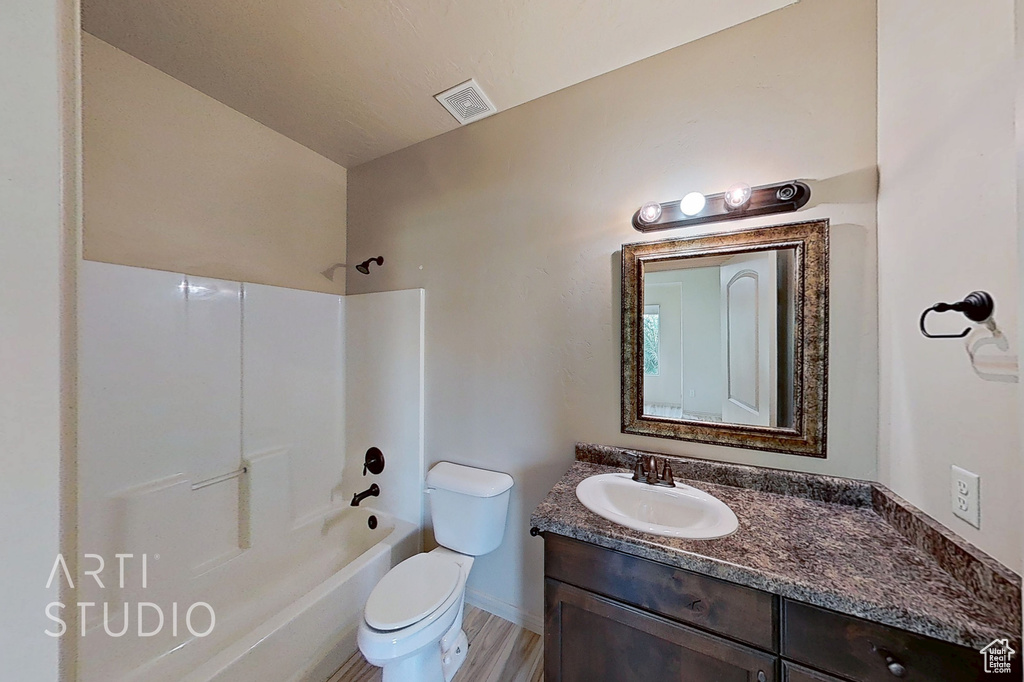 Full bathroom with vanity and washtub / shower combination